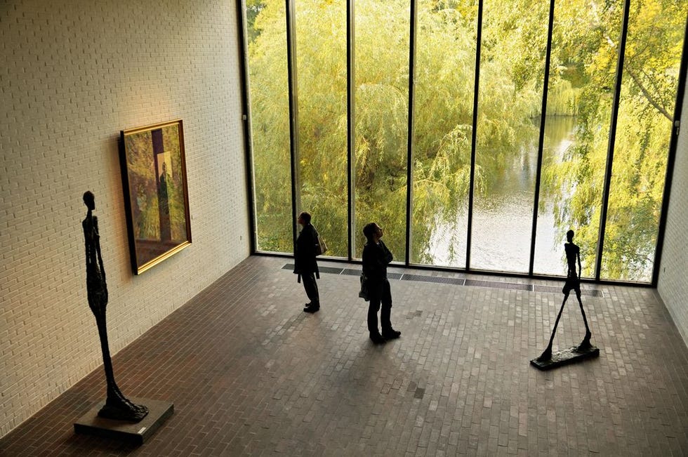Art gallery, Modern art, Yellow, Visual arts, Museum, Tourist attraction, Art, Art exhibition, Exhibition, Sculpture, 