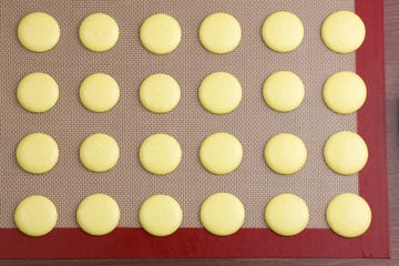macarons on a silicone mat top view