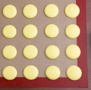 macarons on a silicone mat top view macarons on a silicone mat top view