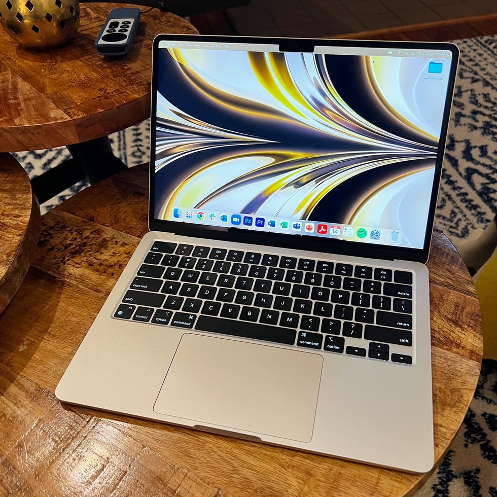 macbook air with m2 chip on side table in living room