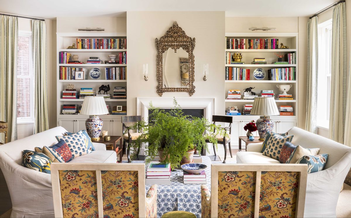 living room, built in bookshelves, indoor plants, white sofa