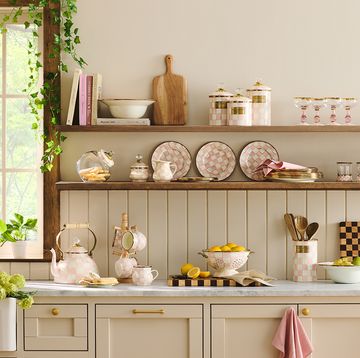 a kitchen with shelves full of dishes