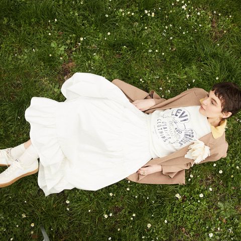 a person lying on grass