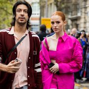 paris, france   october 02 actress madelaine petsch wears pink coat, shorts, cropped top, platform shoes outside valentino paris fashion week   womenswear springsummer 2023  day seven on october 02, 2022 in paris, france photo by christian vieriggetty images