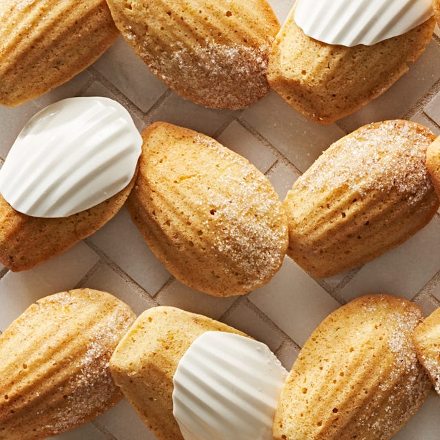 french madeleines, some dipped in white chocolate and some with a dusting of powdered sugar