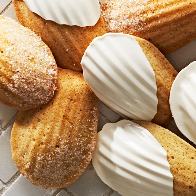 french madeleines, some dipped in white chocolate and some with a dusting of powdered sugar
