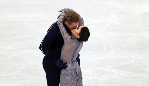 madison chock and evan bates of team united states kiss after the ice dance free dance team event