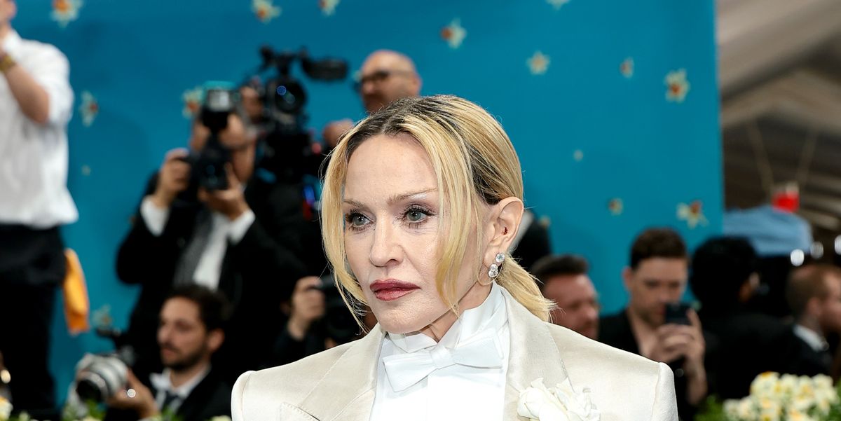 Madonna Returns to the Met Gala in a Sleek Satin Suit—And a Lit Cigar