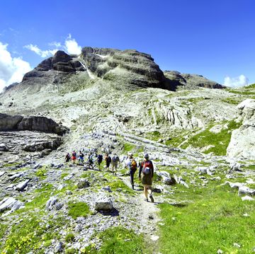 madonna di campiglio, hikers at the groste mountain pass.