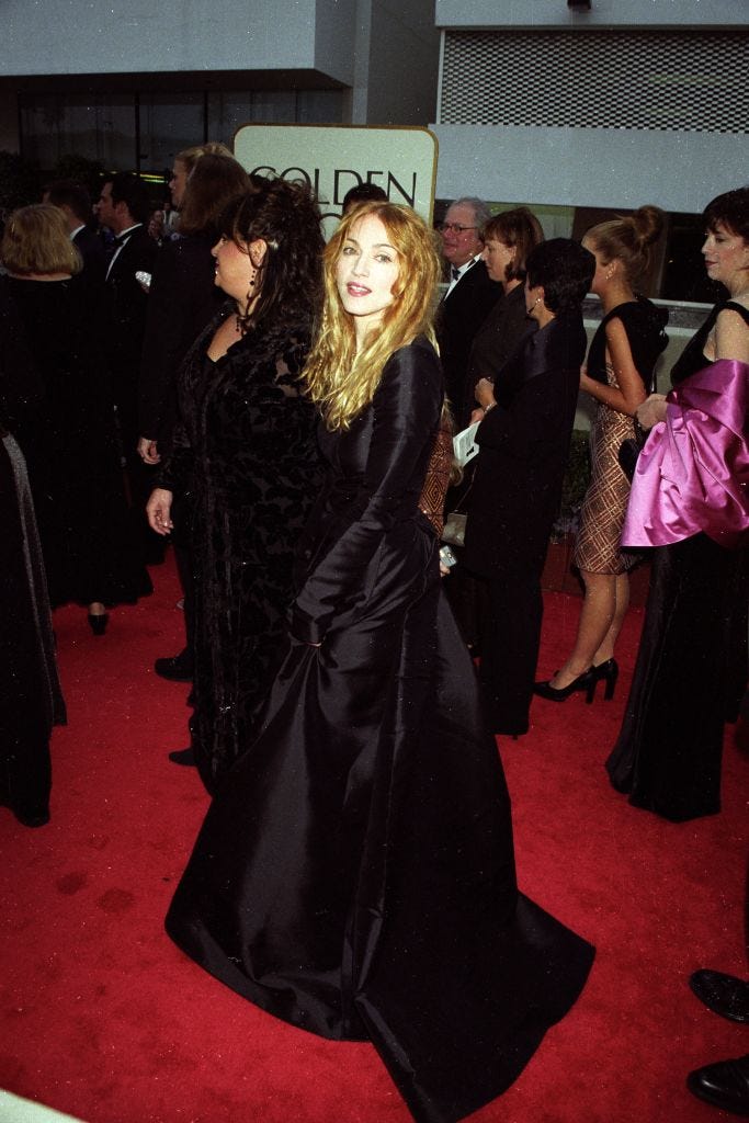 madonna wearing a long sleeved, full skirted black balenciaga dress attends the golden globe awards on january 18, 1998 in los angeles, california article title eye spanning the globes photo by fairchild archivepenske media via getty images