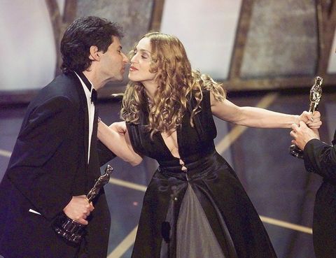 Madonna presents the Oscar to James Horner after h
