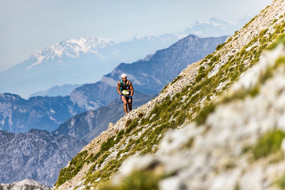a person hiking up a mountain
