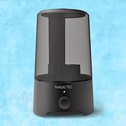 black magictec cool mist humidifier with light blue, textured background