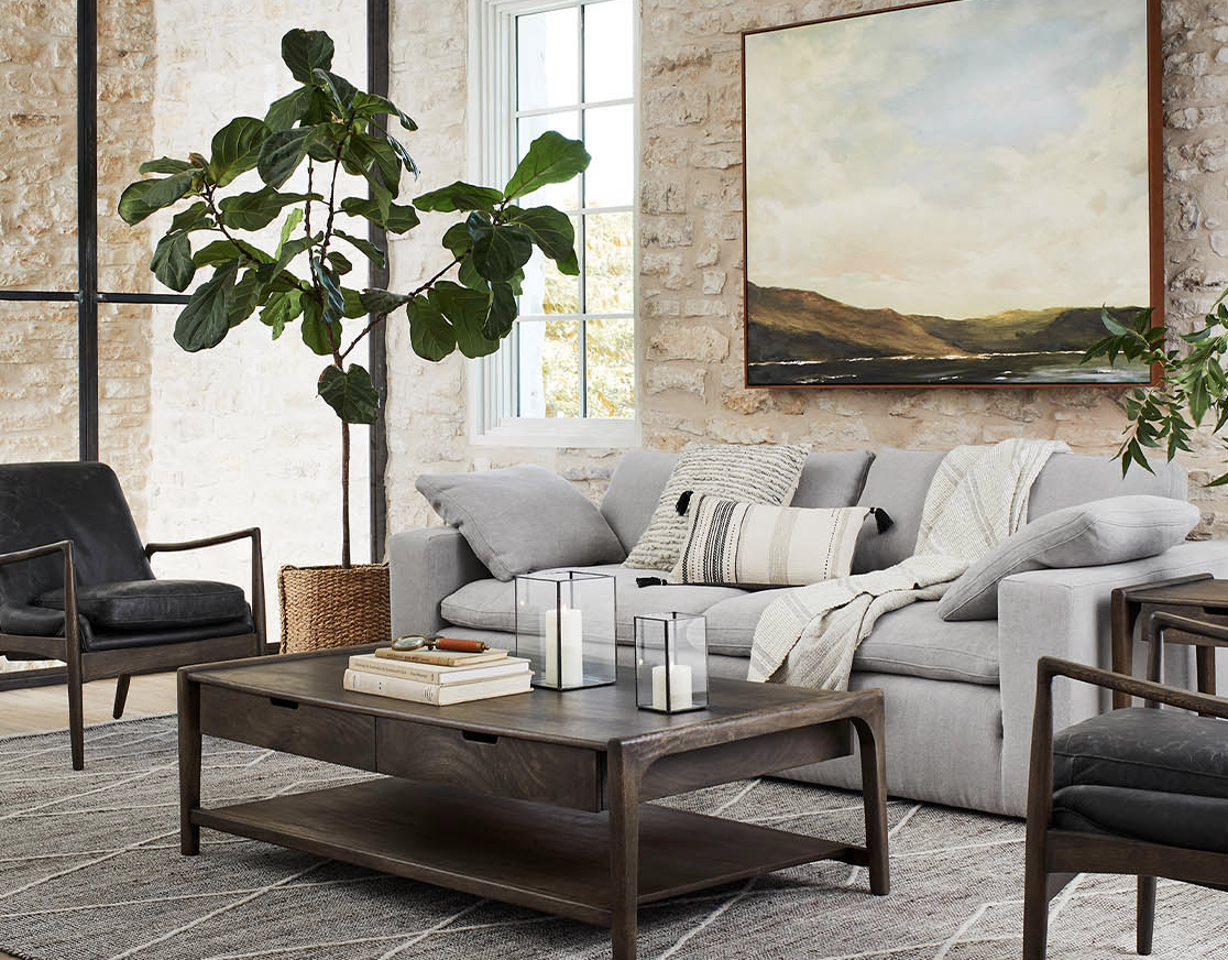 new magnolia furniture collection  displayed in a room with a brick wall