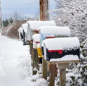 after an icy winter storm rural mailboxes are capped with a fresh dusting of snow