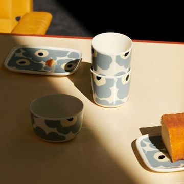 a table with a cup and a plate of food on it