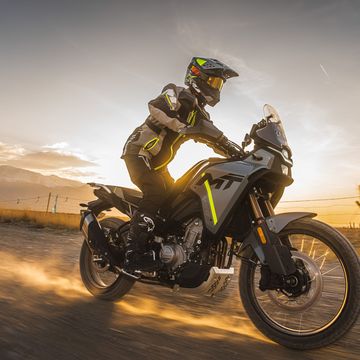 a person riding a motorcycle cfmoto 450mt