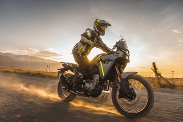 a person riding a motorcycle cfmoto 450mt