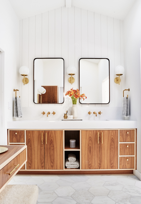 double vanity with custom cabinets in light wood and two mirrors