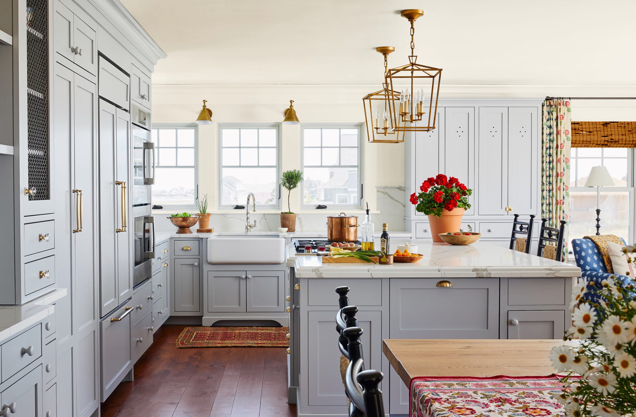 coastal kitchen with gray cabinets and kitchen island painted in silver lining by benjamin moore.
