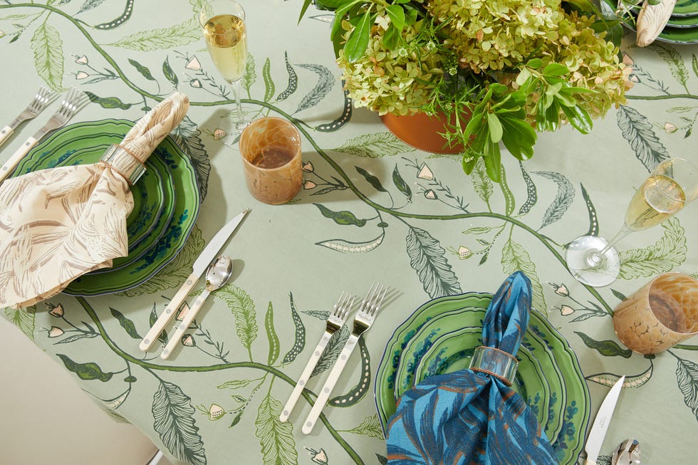 a table with plates and silverware