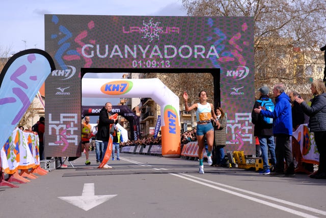 finish line of a running competition with spectators cheering
