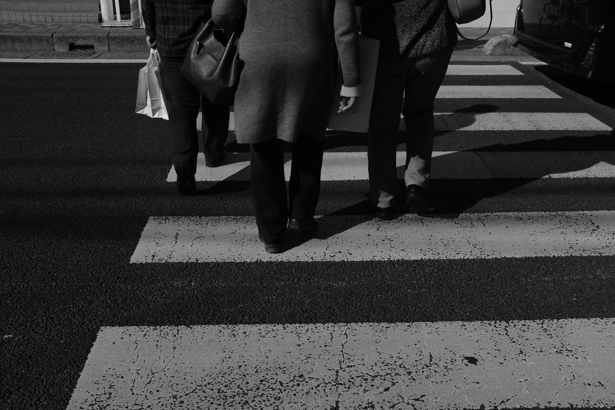 White, Black, Monochrome, Black-and-white, Photograph, Pedestrian crossing, Standing, Human leg, Leg, Shadow, 