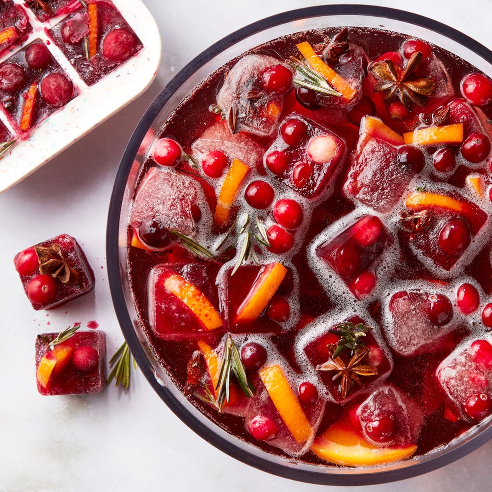 red frozen ice cubes with orange slices and spices