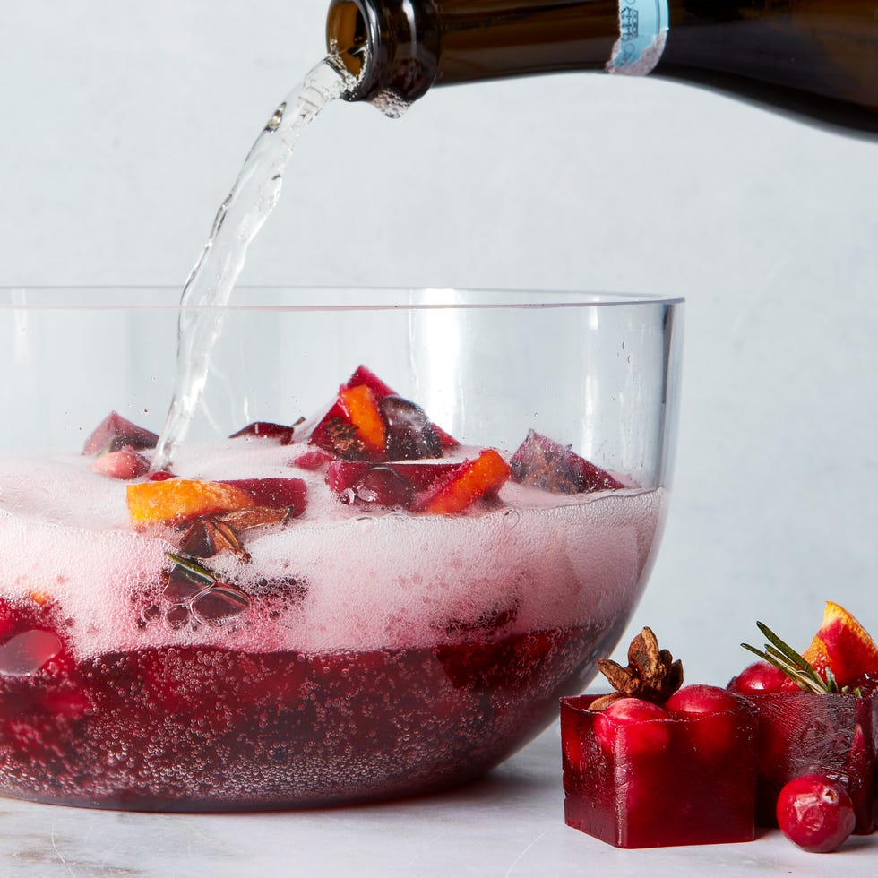 red frozen ice cubes with orange slices and spices