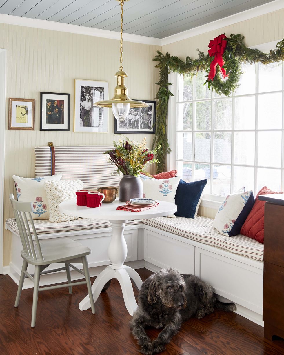 breakfast nook decorated for christmas with dog