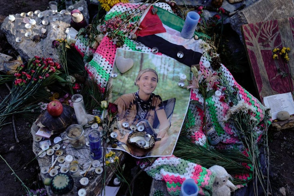 a makeshift memorial with a printed out photo of manuel teran