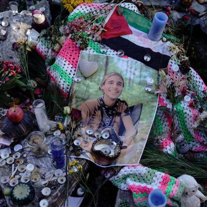 a makeshift memorial with a printed out photo of manuel teran