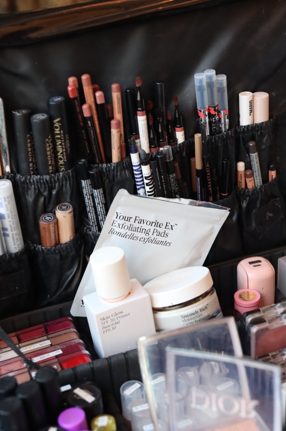 a collection of makeup products on a table