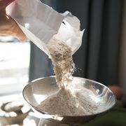 making bread, weighing flour