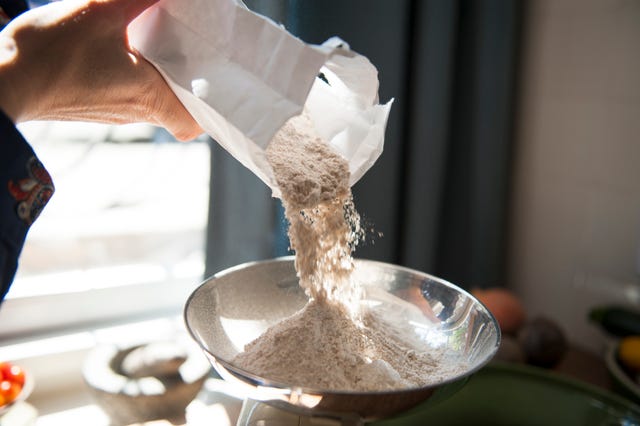 making bread, weighing flour