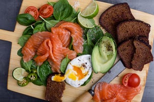 making delicious salad with  salted salmon and fresh vegetables