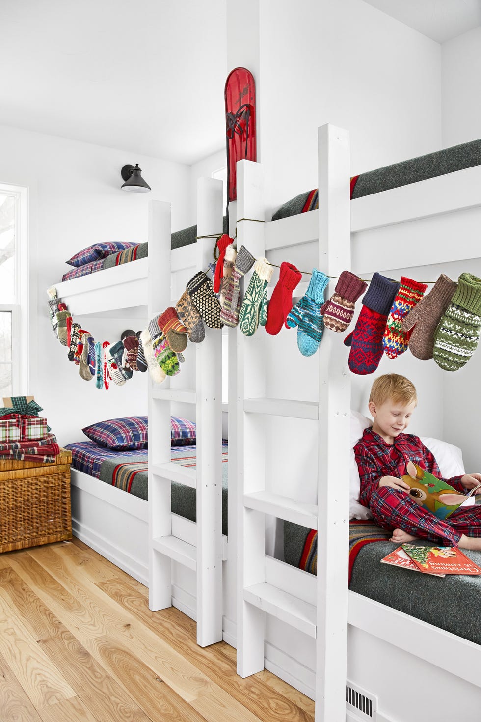 white kids bunk room with a handmade mitten garland