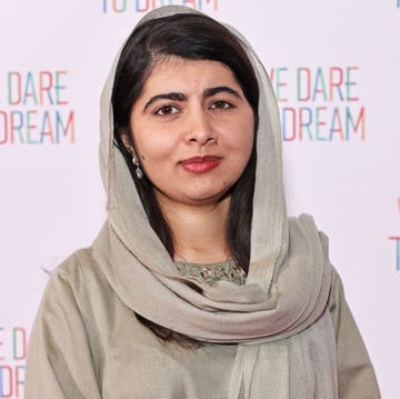 malala yousafzai posing for a photo at a film screening red carpet