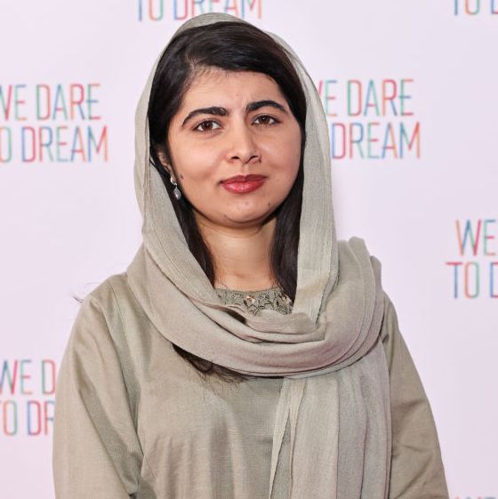 malala yousafzai posing for a photo at a film screening red carpet