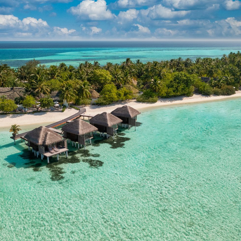 maldives paradise scenery tropical aerial landscape, seascape with long jetty, water villas with amazing sea and lagoon beach, tropical nature exotic tourism destination banner, summer vacation