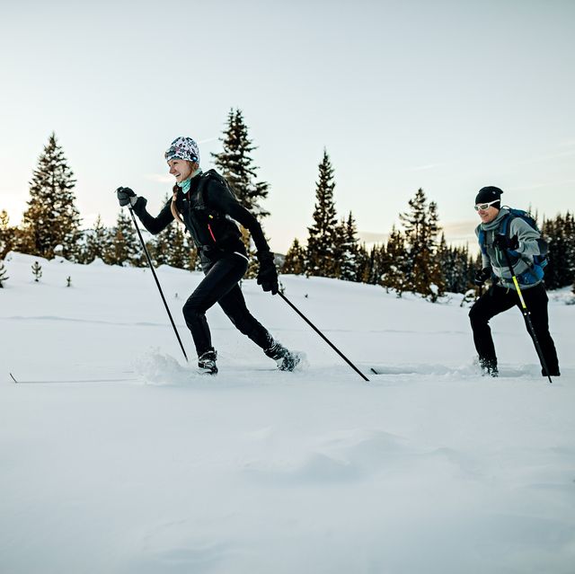 male and female athletes having fun on skis