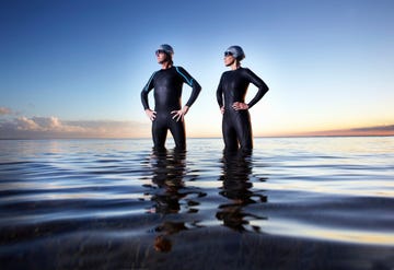 male and female triathlete after swimming event