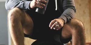 male athlete enjoys delicious health drink