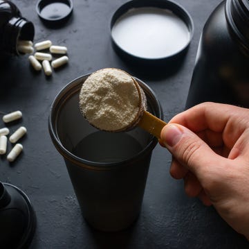 male athlete makes a protein cocktail