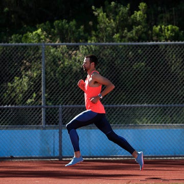 finish fast training a male athlete runs on a track