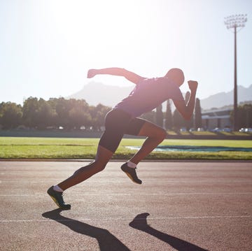 male athlete sprinting out of start block, anaerobic exercise