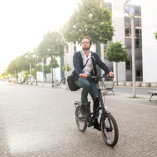 male commuter with electric bike in mitte