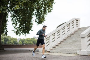 male runner focused during urban park workout