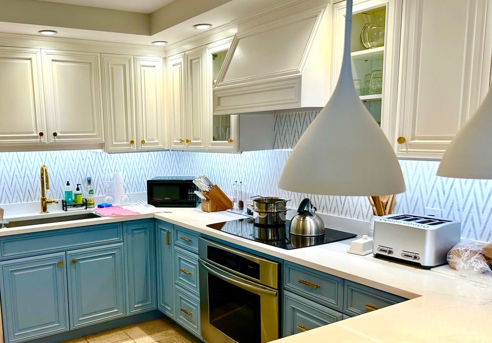 kitchen with white and blue cabinets