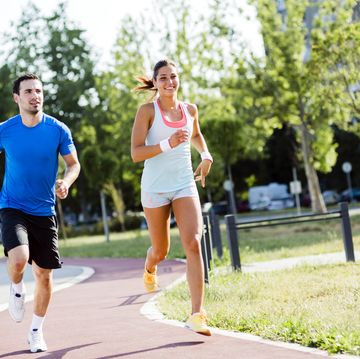 how to increase mileage running man and a woman jogging